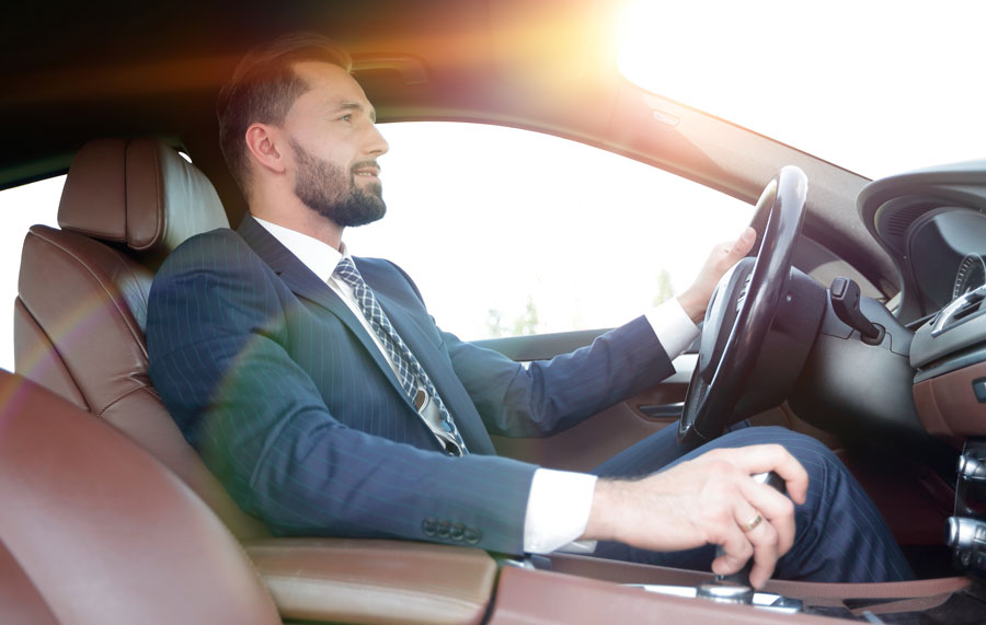 Man driving car covered with auto Insurance in Land O' Lakes, FL